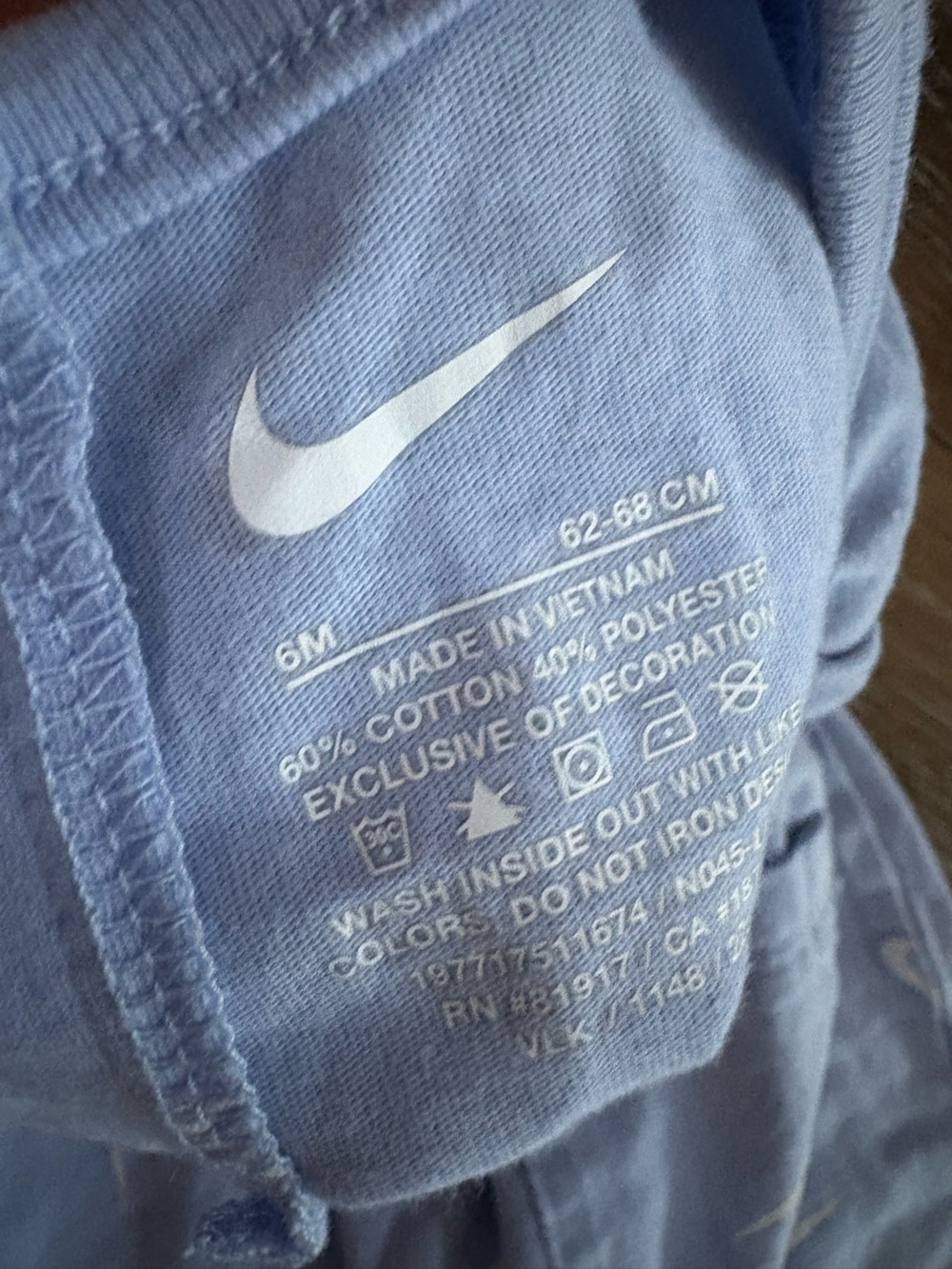 Nike Light Blue Baby One-Piece Romper with White Swoosh Pattern - Picture 2 of 2